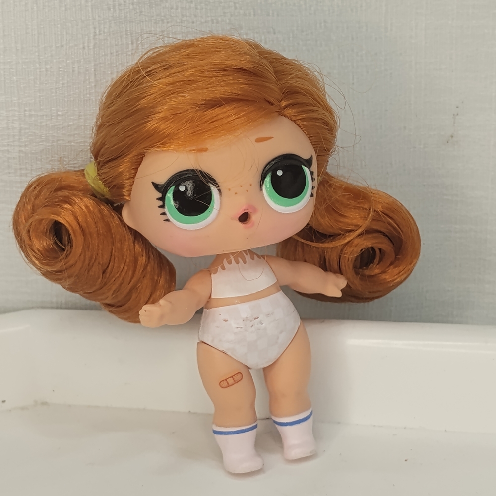 L.O.L. Surprise! Doll with Orange Hair and White Outfit